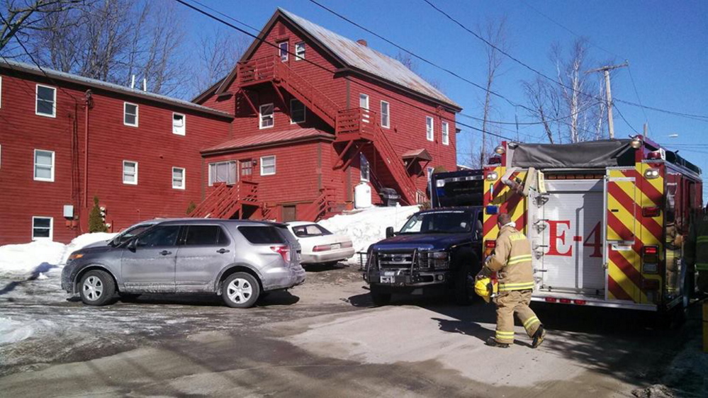 Maine Drug Enforcement Agency officials are seen in March searching 11 Center St. in Oakland in connection with an investigation into methamphetamine manufacturing.