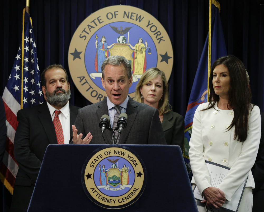 New York Attorney General Eric Schneiderman, center, speaks about a multistate task force formed to address the Northeast heroin crisis during a news conference accompanied by Pennsylvania Attorney General Kathleen Kane, right, on Wednesday in New York.