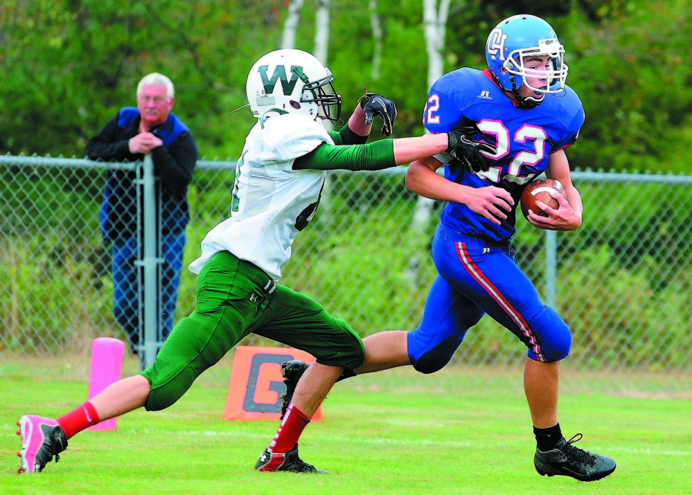 Winthrop cornerback Dakota Carter, left, chases Oak Hill running back Alex Mace during a Western D Campbell Conference game last season. This season, Carter has 39 tackles and two interceptions. Defensively