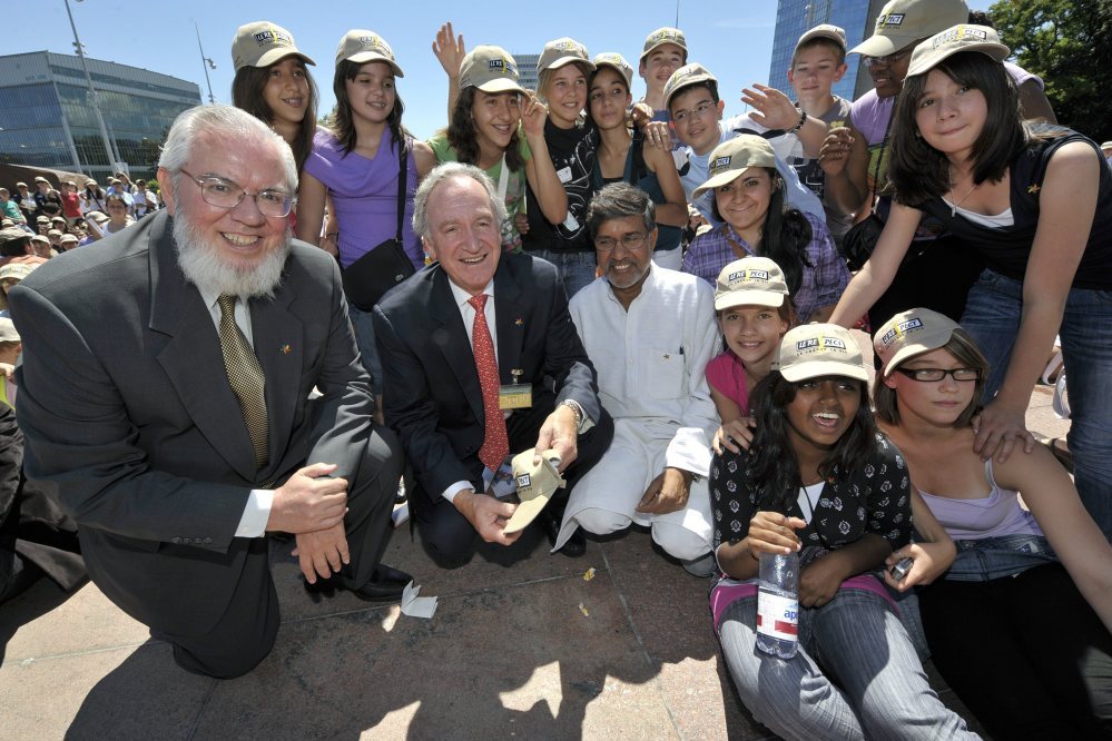 Kailash Satyarthi, , third from left, Indian coordinator of the Global March against child labour, Chilean Juan Somavia, left, director general of the International Labor Organization, Tom Harkin, second from left, senator of Iowa at the Congress of the United States, pose with school children of the Canton of Geneva, during the World Day Against Child Labour at the Place of Nations in front of the European headquarters of the United Nations in Geneva, Switzerland in 2009.
