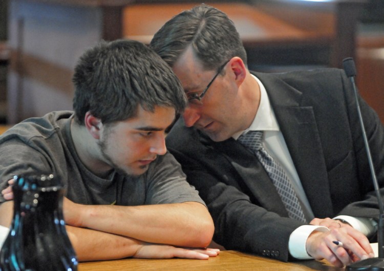Kevin Peaslee, left, listens to his attorney James Lawley during a hearing in Kennebec County Superior Court on Friday. Peaslee pled guilty to assaulting his infant daughter when he shook her violently last December.