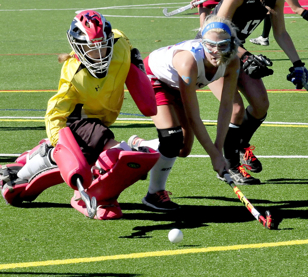 Messalosnkee’s Nathalie St. Pierre tries to get ball past Skowhegan keeper Leah Kruse during a game Monday in Waterville. Messalonskee won 4-2.