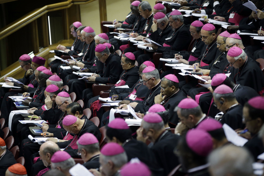 Bishops attend a morning session of a two-week synod on family issues at the Vatican, Monday.