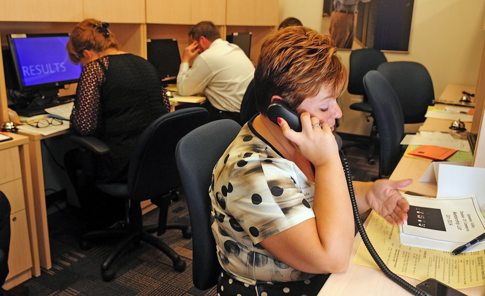 Nicole McSweeney, MaineGeneral’s Vice President of Development & Communications, right, and other volunteers make calls to solicit new Kennebec Valley Chamber of Commerce members on Thursday October at Kaplan University in Augusta.