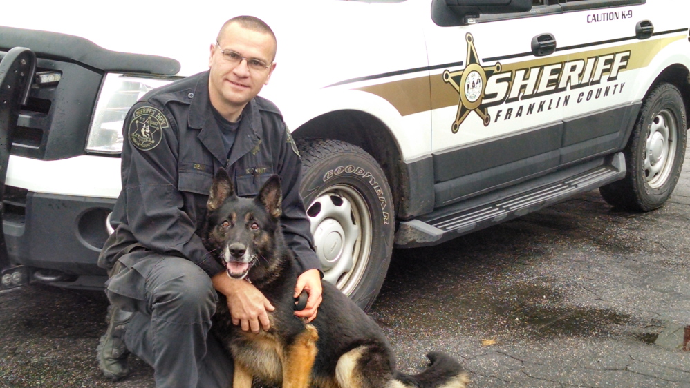 Cpl. Nate Bean with his dog, Diesel.