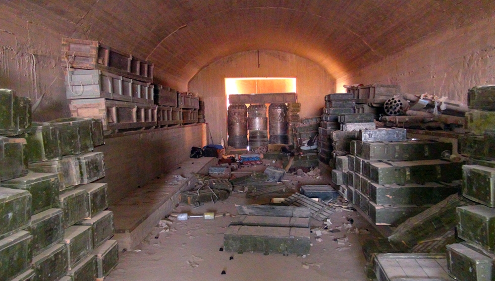 This munitions warehouse was captured by the Islamic State group in Raqqa, Syria. The group is reported to be test flying fighter jets captured on air bases belonging to the Syrian military.