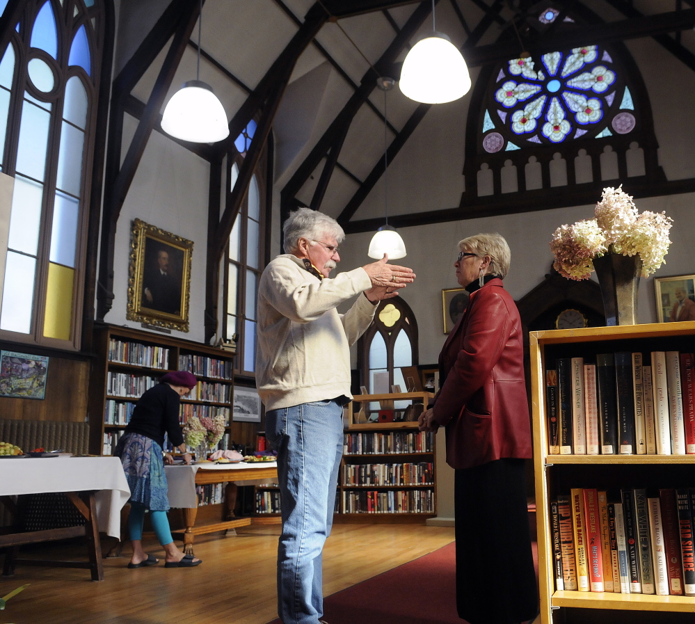 Guests visit the Hubbard Free Library Sunday as the Hallowell institution celebrates achieving its fundraising goal for the first phase of a capital campaign. While several hundred thousand dollars has helped repair the exterior of the 19th century structure, more money is needed to protect and restore the stained windows at the library.