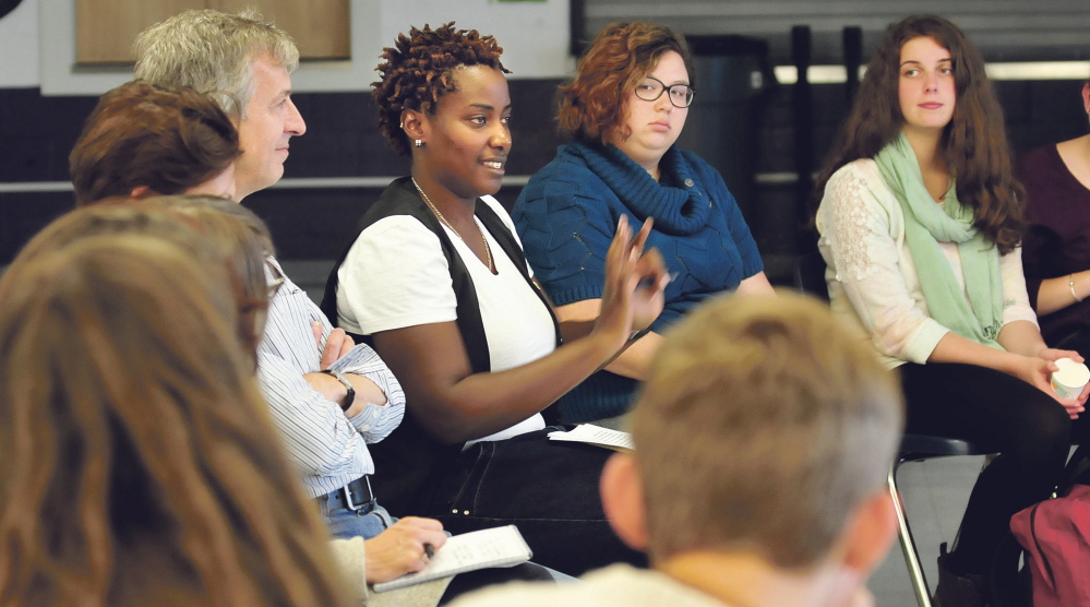 Clare Byaraguba of Uganda, center, talks with Waterville Senior High School students about discrimination and bullying issues Monday. Byaraguba asked the local students about how creating a diverse group against lesbian, gay, bisexual and transgender discrimination has worked at the school.
