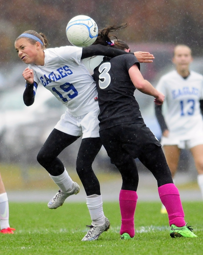 Erskine midfielder Avery Bond, left and Lincoln midfielder Olivia York collide as they go up for header during a game Tuesday in South China.