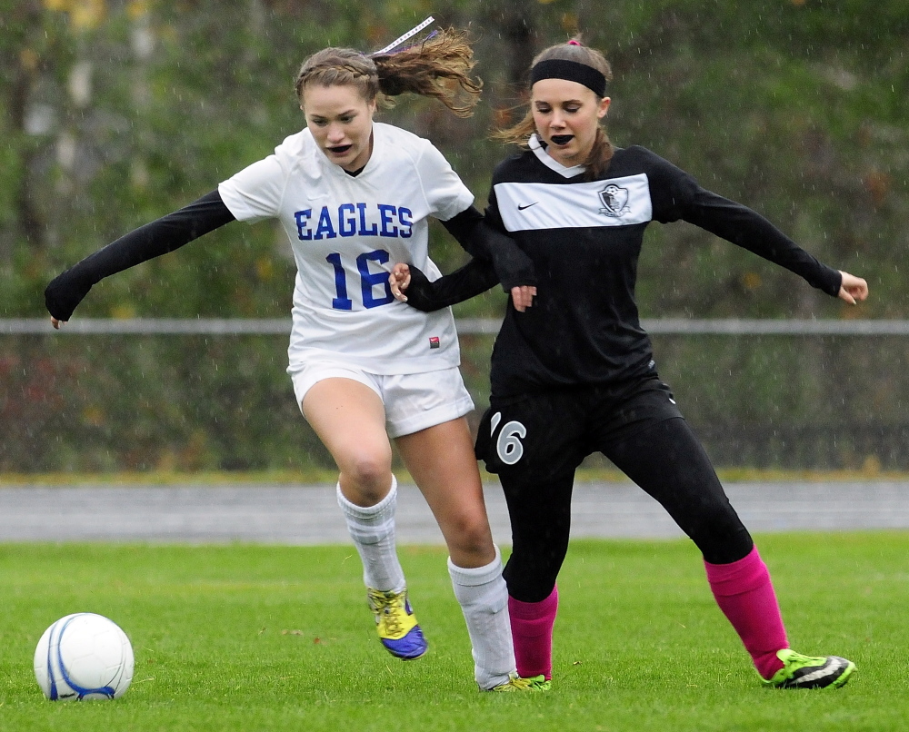 Erskine striker Christina Belanger, left, and Lincoln back Alyssa Smith battle for a ball during a game Tuesday in South China.