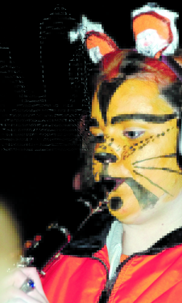 Staff file photo by Joe Phelan 
 Gardiner Area High School band member Valarie Lohan, of Pittston, plays during hal time of the 2004 Cony-Gardiner game.