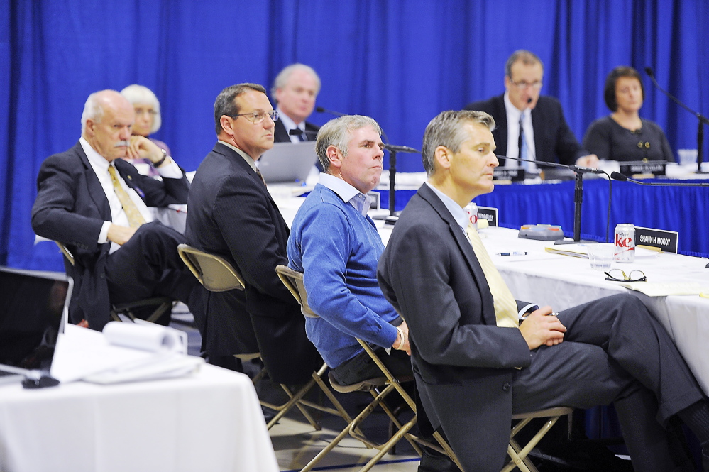 PORTLAND, ME - OCTOBER 24: Members of the University of Maine System Board of Trustees listen to students and instructors speaking to change their minds before their vote to cut programs and staff because of budget shortfalls. (Photo by Gordon Chibroski/Staff Photographer)