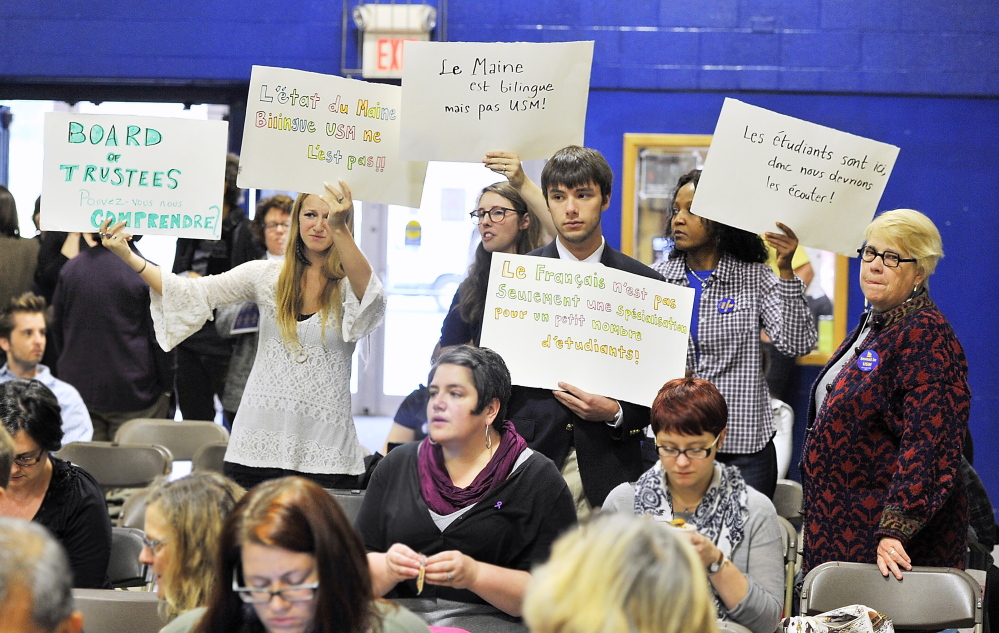 PORTLAND, ME - OCTOBER 24: Unhappy students of the French department protest the elimination of the French language department headed by Nancy Erickson, right, Assistant  Professor of French, as students and instructors speak before the UMaine System Board of Trustees at Sullivan Gym before they vote to cut programs and staff because of budget shortfalls. (Photo by Gordon Chibroski/Staff Photographer)