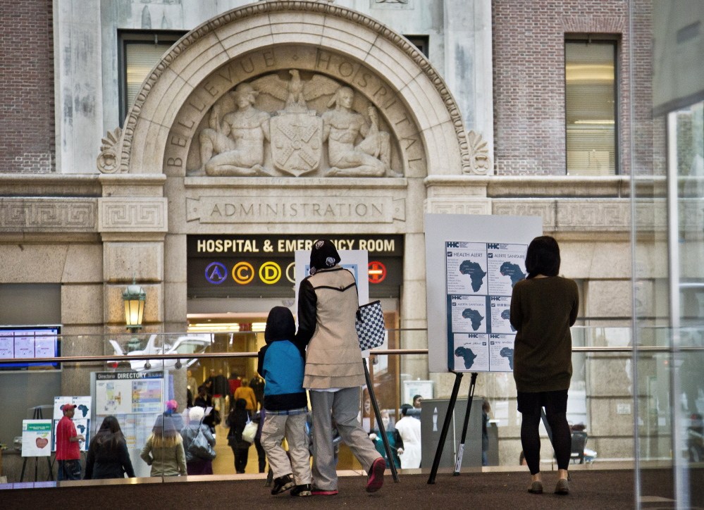 Health alerts for travelers to particular West African countries posted at the main lobby entrance of Bellevue Hospital in New York. New York health officials are known for holdings drills on handling emergencies, and Ebola is no exception. Bellevue, the country’s oldest public hospital, had been preparing for an Ebola patient in earnest since August. And when Ebola did come to New York via Dr. Craig Spencer, who had been treating patients in Guinea, he was transported to Bellevue by specially trained emergency workers cloaked in protective gear.