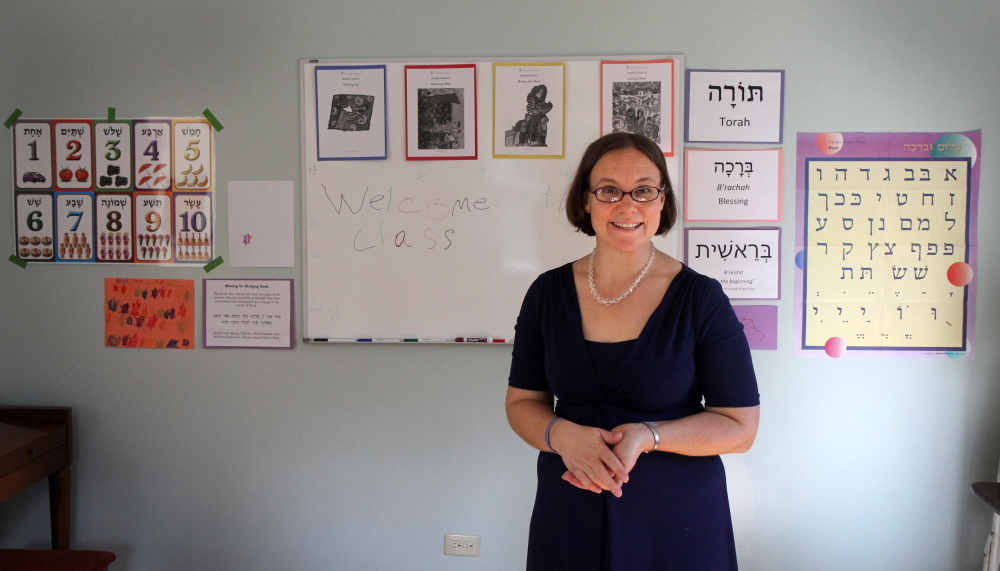 Temple Beth El Rabbi Erica Asch shows off the first and second grade classroom inside the Nancy and Charlie Shuman Center for Jewish Learning after the building’s dedication in Augusta on Sunday.