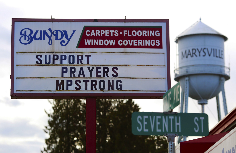 A variety of supportive signs have appeared on businesses along State Street in Marysville, Wash., Saturday after a deadly shooting Friday at Marysville-Pilchuck High School.