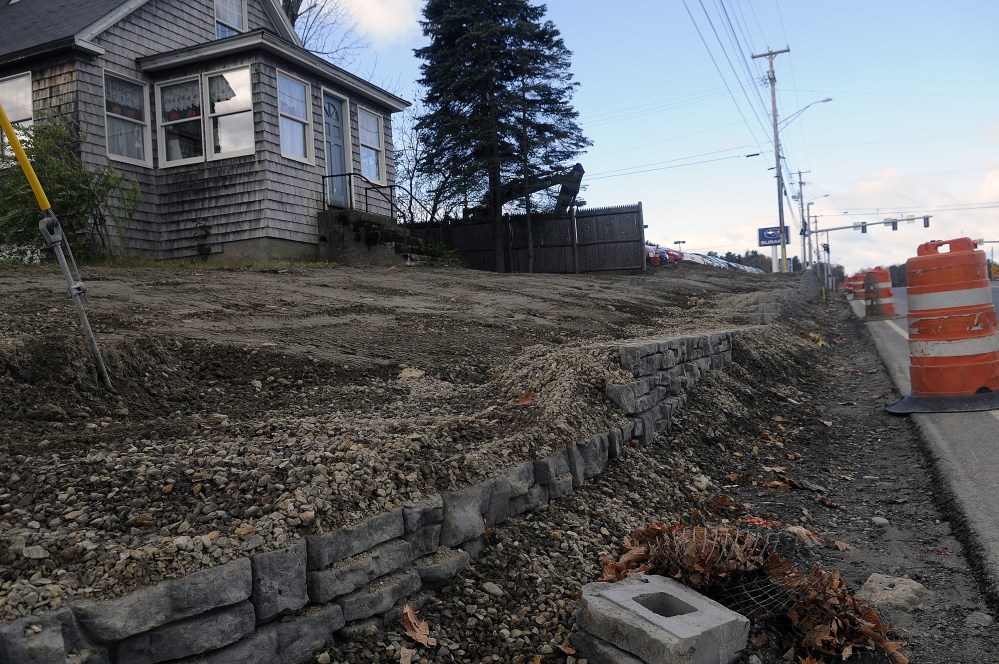 The stone retaining wall at the intersection of Smith Street and Western Avenue in Augusta has been lowered in response to complaints by residents.