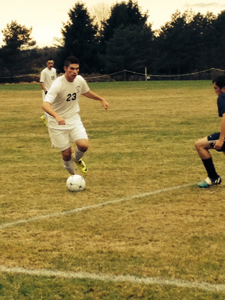 Richmond junior Mike Stewart looks for some room during a Western D quarterfinal game Tuesday against Greenville. The top-seeded Bobcats prevailed 3-1.