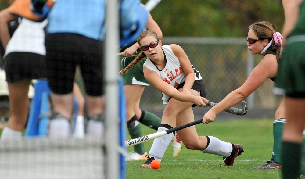 Winslow’s Jessica Greeley, center, takes a shot on goal during the second half of an Eastern C semifinal game against Mount View on Tuesday.