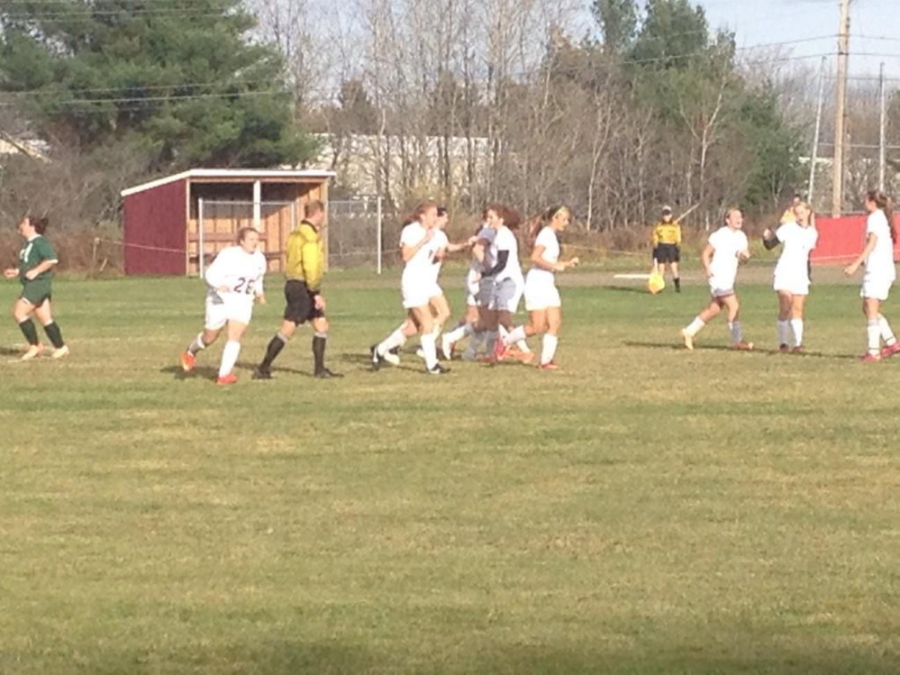 Members of the top-seeded Richmond girls soccer team celebrate a Meranda Martin goal during a Western D semifinal game Friday.