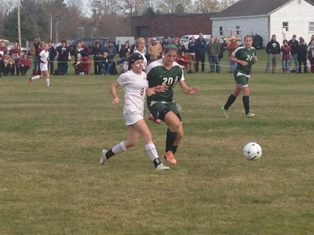 Richmond forward Meranda Martin, left, battles Rangeley defender Blayke Morin for the ball during a Western D semifinal game Friday afternoon. Rangeley’s Celia Philbrick trails the play.