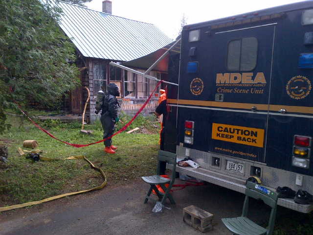 Maine Drug Enforcement Administration agents have conducted several raids on alleged methamphetamine laboratories in central Maine over the past several months, including a raid in Phillips in July, shown here, in which four people were arrested. 