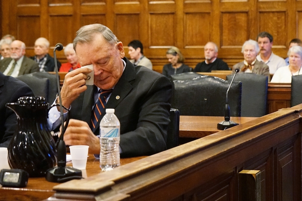 Former Maine State Police Chief Andrew Demers Jr. wipes tears from his eyes as a former police colleague testifies in the Cumberland County Courthouse on Tuesday, about how Demers’ actions, sexually assaulting a 4-year-old child, have tarnished the reputation of the police force.