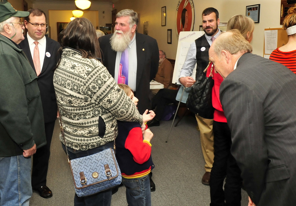 Candidates greet voters at the Skowhegan municipal building arriving to vote on Tuesday. From left are candidates for Judge of Probate John Martin and John Youney, while Democratic State Rep. Jeff McCabeof House  District 107 and his Republican challenger Tim Amadon, foreground, join the campaigning.