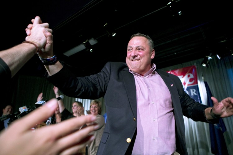 Gov. Paul LePage celebrates his re-election Tuesday night at a party in Lewiston. LePage defeated Democrat Mike Michaud and independent Eliot Cutler.