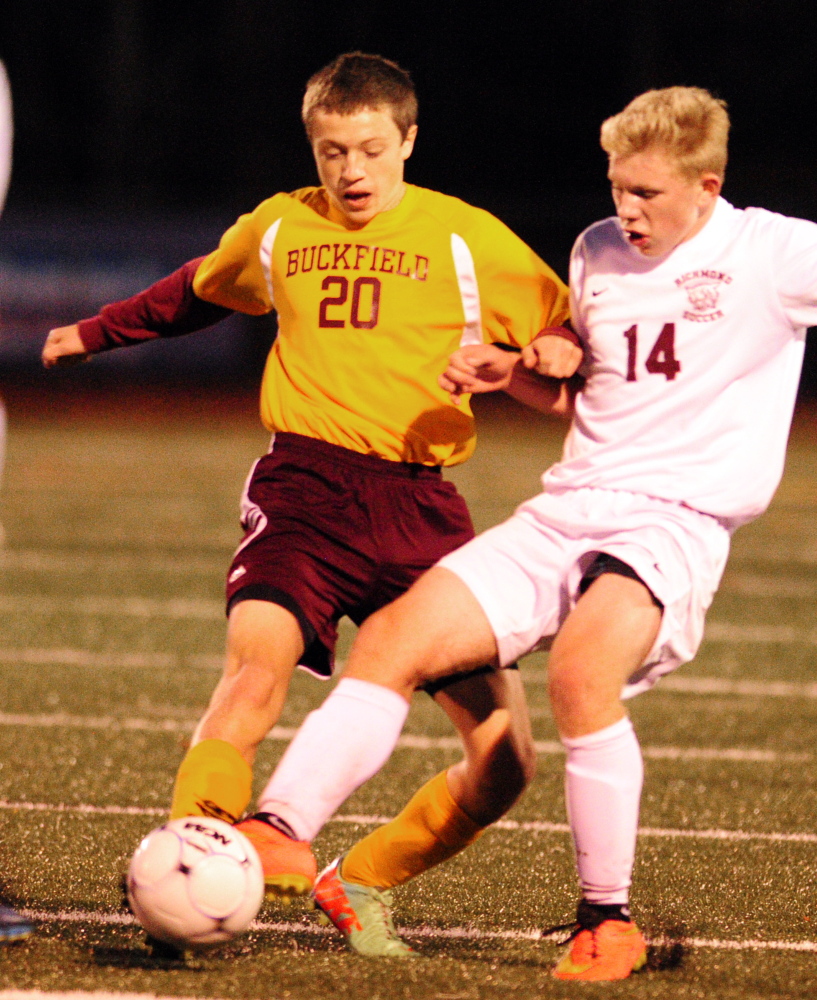 Buckfield’s Noah Patenaude, left, and Richmond’s Brendan Emmons battle for a ball during the Western Maine Class D boys soccer final Wednesday at McMann Field in Bath.