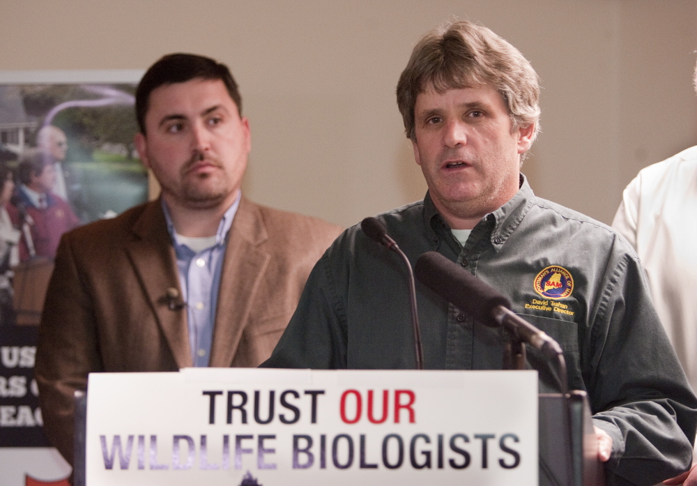 Sportsmen’s Alliance of Maine Executive Director David Trahan makes a victory speech Tuesday for No On 1 at the Black Bear Inn in Orono on election night. Campaign Manager James Cote watches at left.