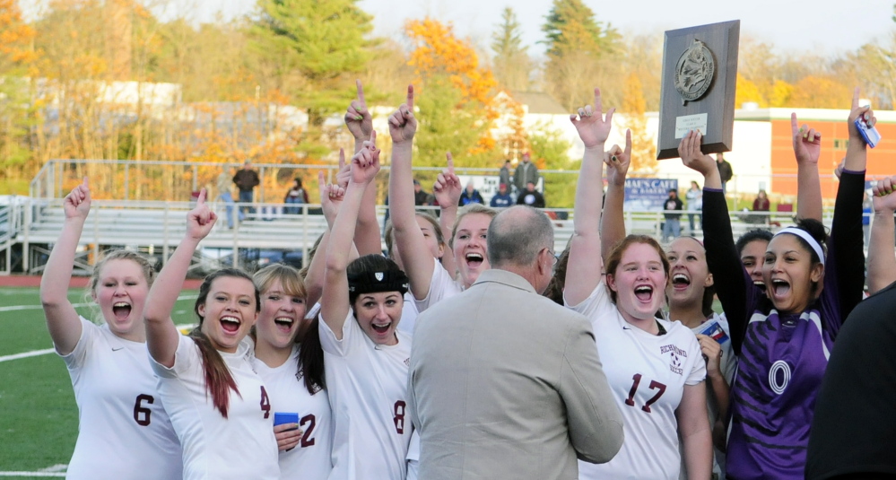 BATH, ME - NOV. 5: Richmond Bobcats celebrate beating Searsport for the Western Maine Class D girls soccer final on Wednesday November 5, 2014 at McMann Field in Bath. (Photo by Joe Phelan/Staff Photographer)