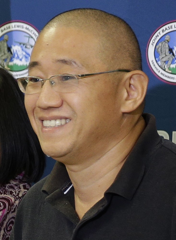 Kenneth Bae, left, and Matthew Miller arrived late Saturday at Joint Base Lewis-McChord in Washington state.