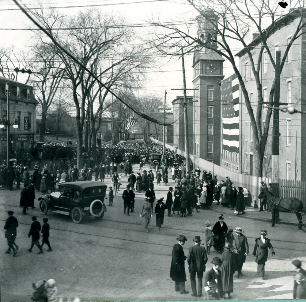 The grounds outside Pepperell Mill #3, now known as Lincoln Mill in Biddeford, bustles with activity in 1917.