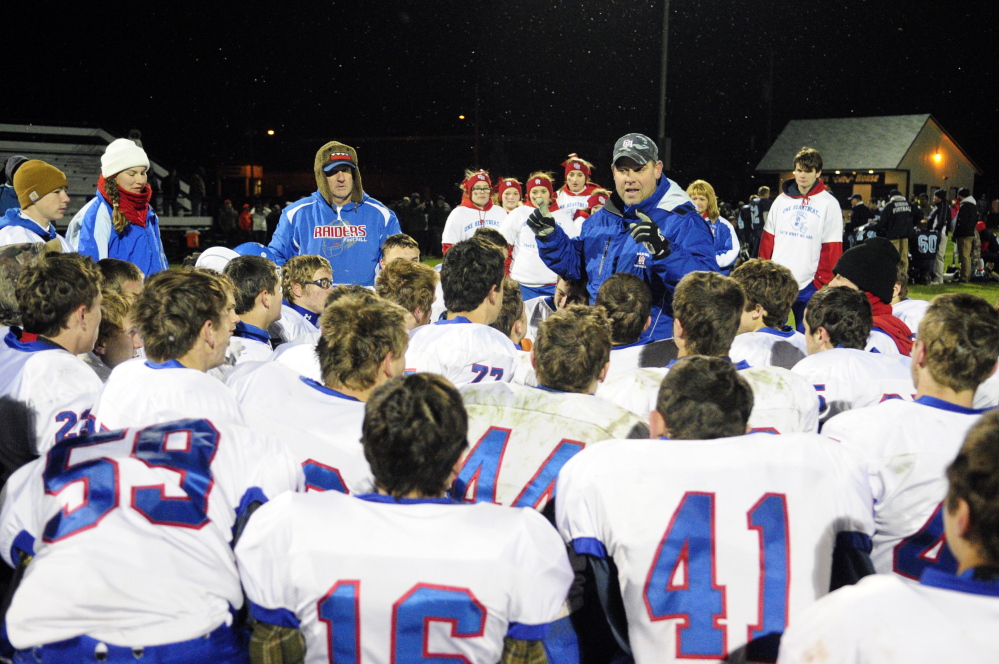 Oak Hill coach Stacen Doucette talks to the team after it beat Dirigo in a Western D semifinal game last Friday in Disxfield. Doucette leads the Raiders into the conference championship game Saturday against Lisbon.