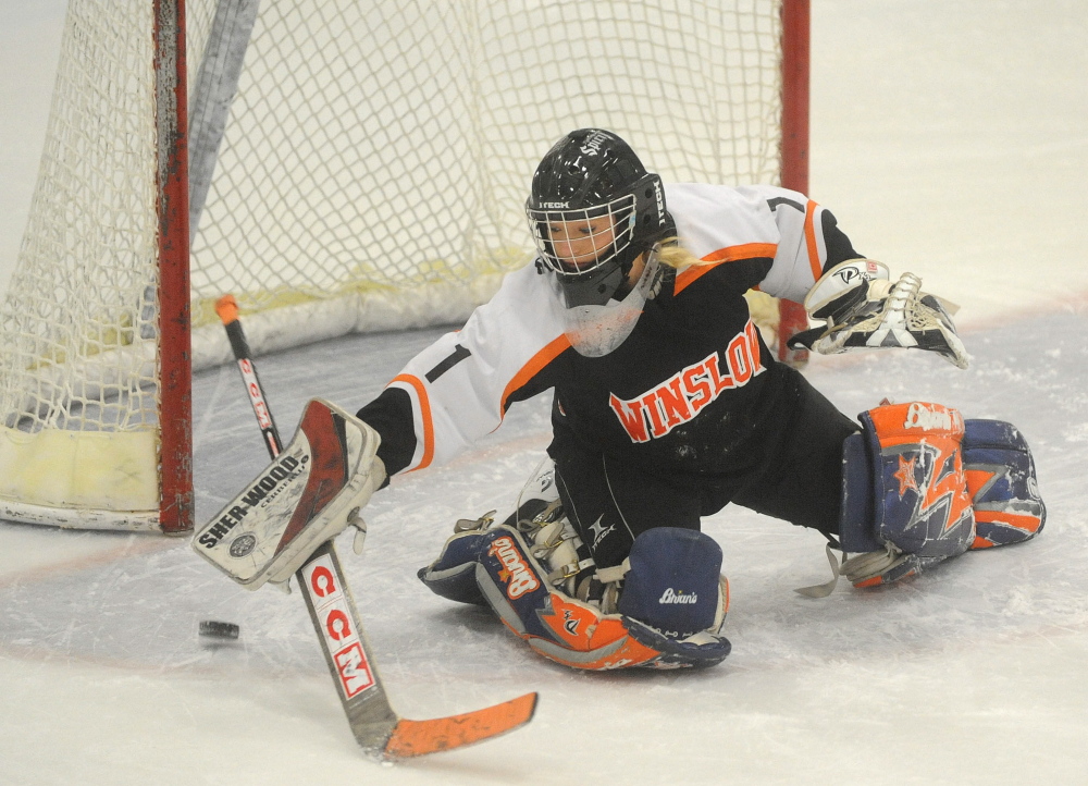 Staff photo by Michael G. Seamans 
 Winslow High School goalie Kiana Richards makes a save during a practice Thursday at Sukee Arena in Winslow.