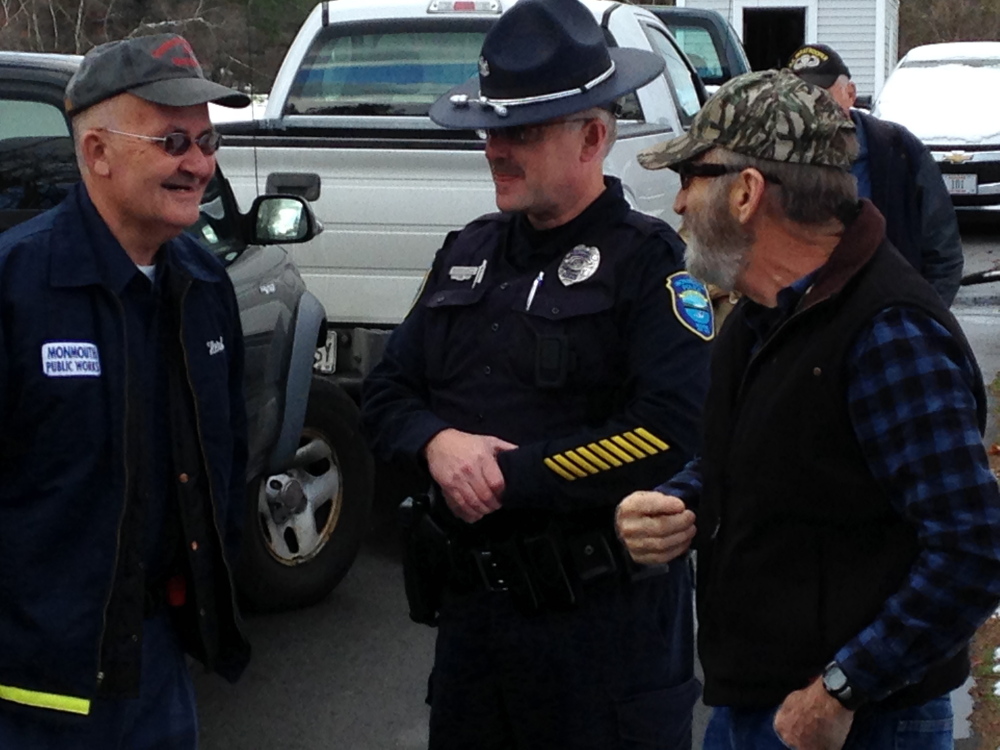 Monmouth Public Works Director Herb Whittier, left, talks with Monmouth Police Officer Mike Parshal and public works employee Leonard Crocker Friday during a gathering to honor Whittier for his nearly 45 years of service to the town.