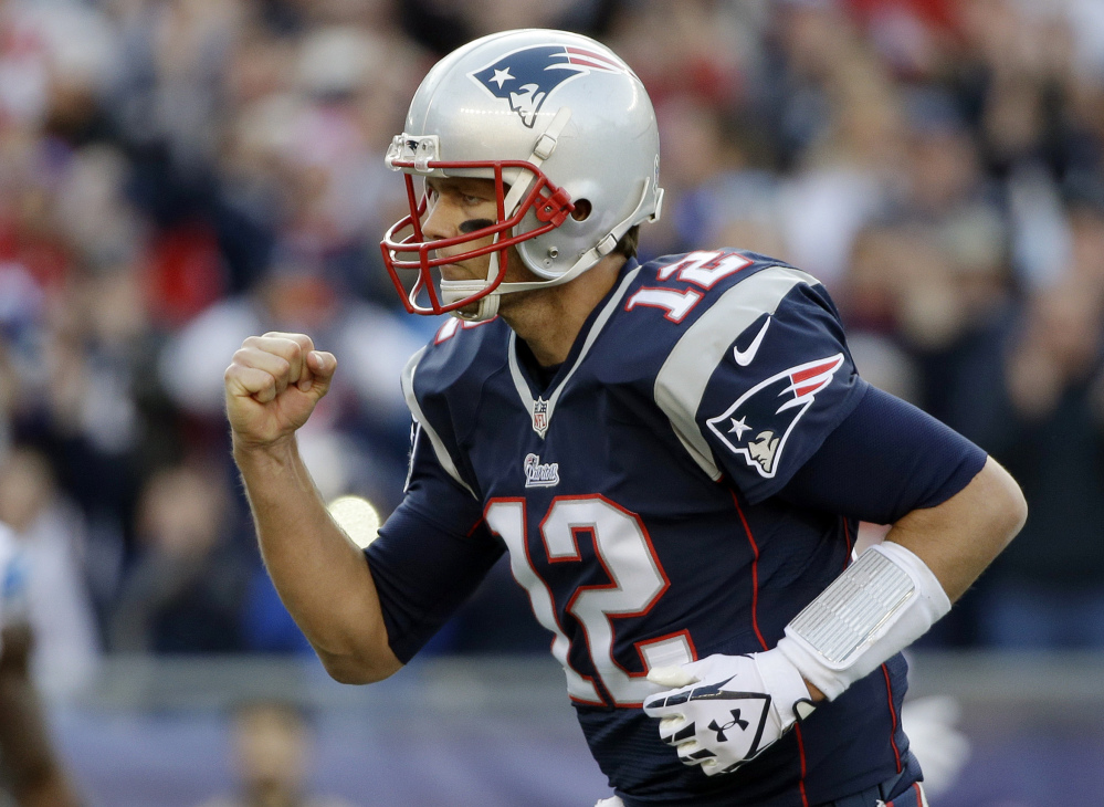 Patriots quarterback Tom Brady celebrates his second touchdown pass to Timothy Wright in the first half Sunday against the Detroit Lions at Gillette Stadium in Foxborough, Mass.