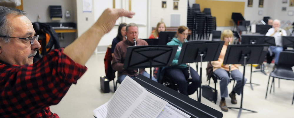 Charles T. Milazzo conducts members of the Kennebec Performing Arts Company during rehearsal Tuesday in Augusta.