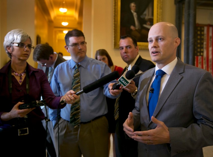Ben Grant, chairman of the Maine Democratic Party, right, will step down after four years. 2013 Associated Press File Photo/Robert F. Bukaty