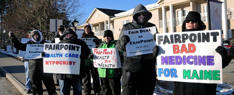Bundled up against single digit temperatures, strikers picket Tuesday outside a health care conference sponsored in part by FairPoint Communications. Union workers across New England went on strike against the telecommunications firm on October 17 after the company imposed higher health insurance premiums, according to a release from the International Brotherhood of Electrical Workers, which represents many of the FairPoint employees.  The conference, organized by the Maine State Chamber of Commerce, at the Senator Inn will focus on the Affordable Care Act.