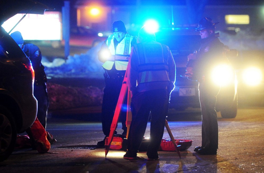 Fairfield police investigate the scene where a man was struck by a Subaru Outback on Main Street in Fairfield on Thursday.