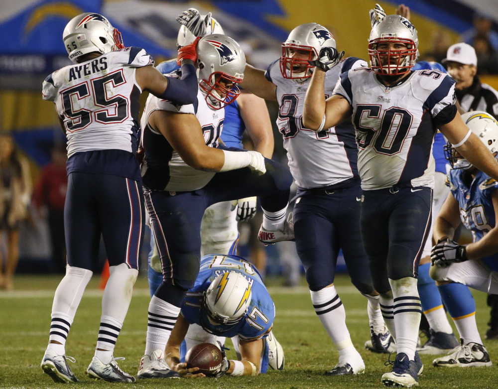 Linebacker Akeem Ayers, left, has been one of several defensive newcomers that have aided in the success of the New England Patriots during the regular season. The Patriots host the Miami Dolphins on Sunday in Foxborough, Mass.