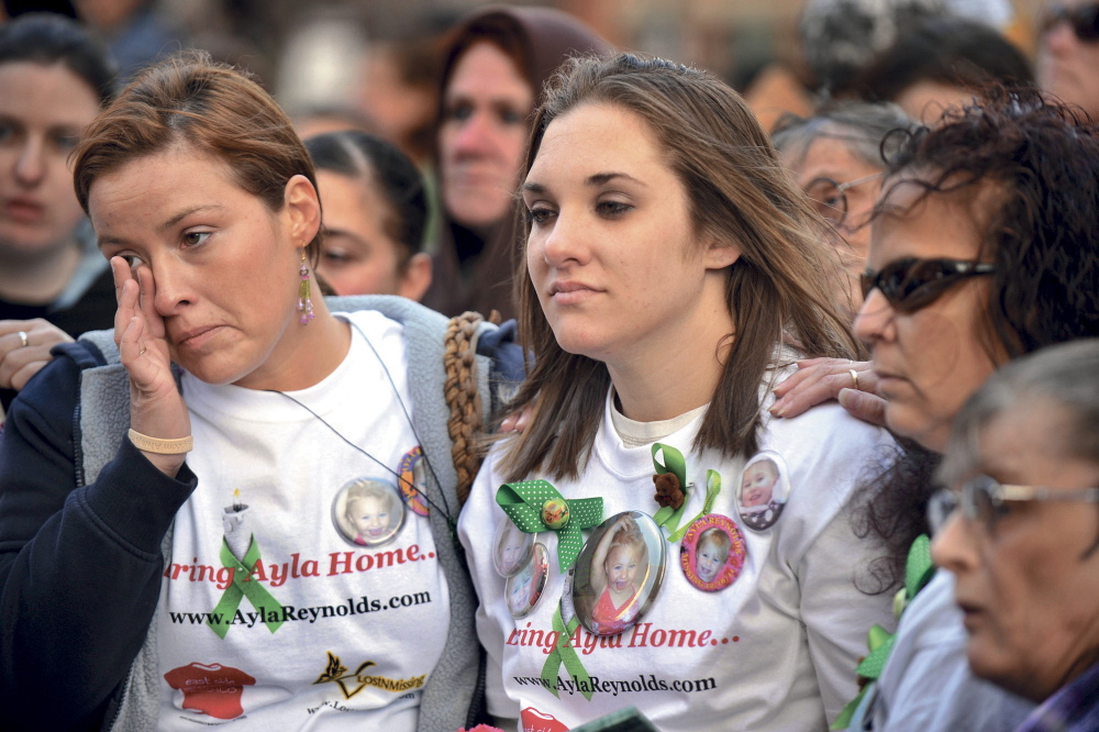 A rally in support of Ayla Reynolds is held in Portland’s Monument Square on her 2nd birthday, April 4, 2012. Ayla’s mother, Trista Reynolds, right, and her friends listen to a song written for Ayla.