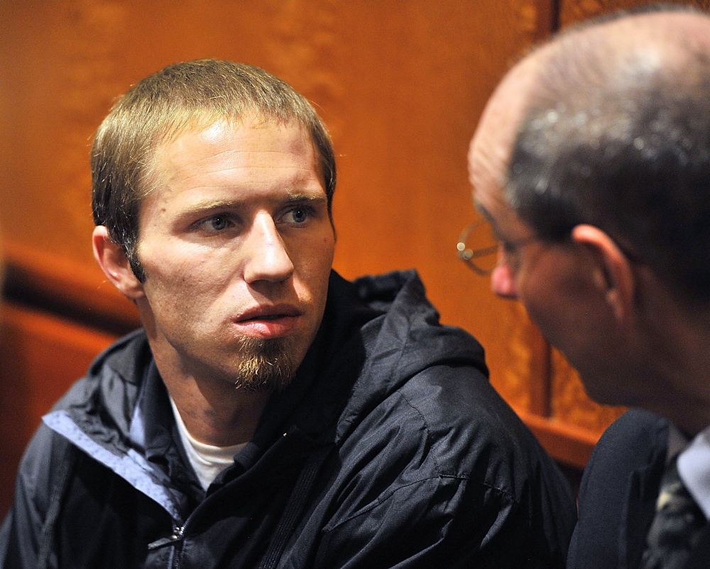 Justin DiPietro talks to his attorney, Gerard Conley Jr., prior to appearing before the judge in court on an assault charge that was plea bargained to a lessor charge on Sept. 25, 2013.