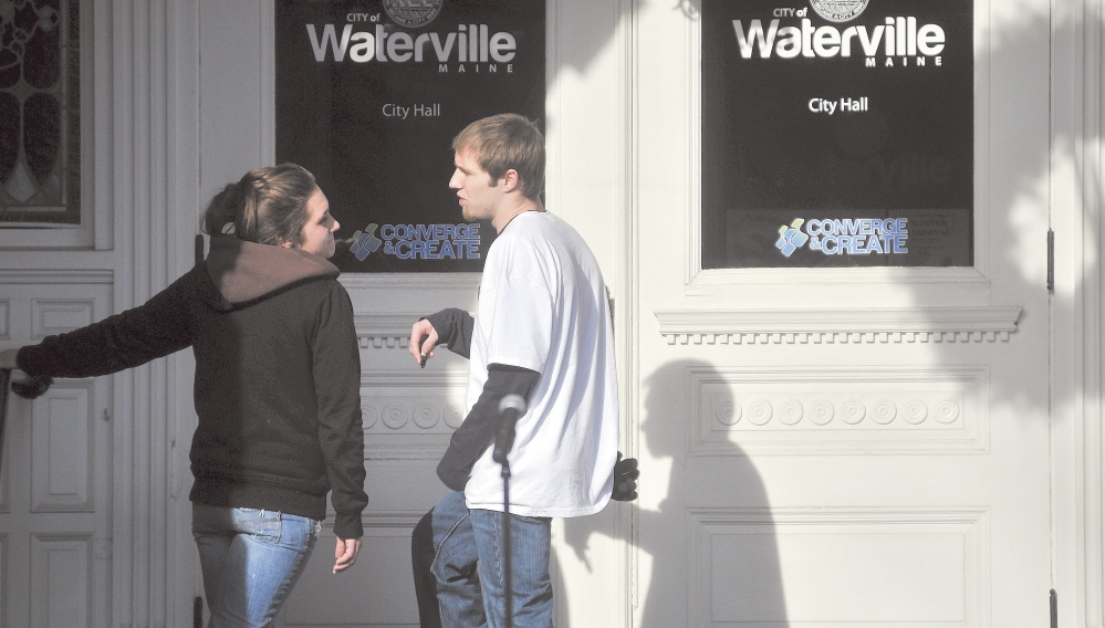 Trista Reynolds, left, and Justin DePietro, right, speak on the steps of City Hall during a vigil in Castonguay Square in Waterville for their missing toddler, Ayla Reynolds.