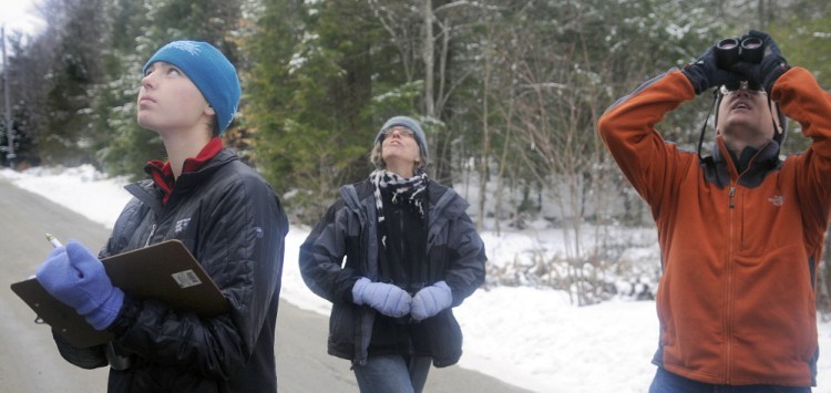 Anna Hodgkins, left, Tina Wood and Hodgkins’ father, Glenn, record birds they sight in Farmingdale while participating in the annual Christmas Bird Count on Sunday. The Hodgkins, of Hallowell, and Wood, of Gardiner, were one of several teams that searched for avians throughout Kennebec County.