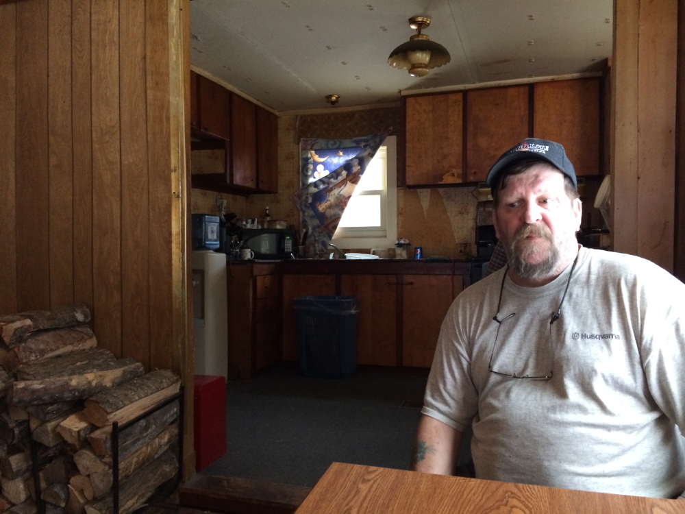 Tim Gregory, who lives across the street from Dana Craney and his grandmother, Joanne Goudreau, speaks with a reporter at his home on Sunday. In recent weeks Goudreau had been coming to Gregory and his wife for help because her grandson was hitting her, he said.