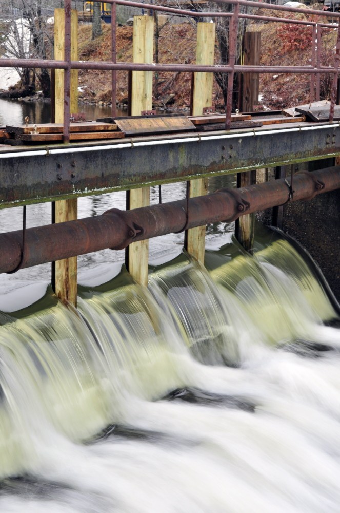 The posts that hold the flashing boards that are inserted or removed to control the water level at the New Mills Dam.