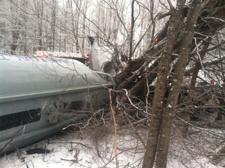 The driver of a tractor-trailer that truck rolled over on New Portland Road in Embden Tuesday morning was taken to the hospital for non-life threatening injuries.